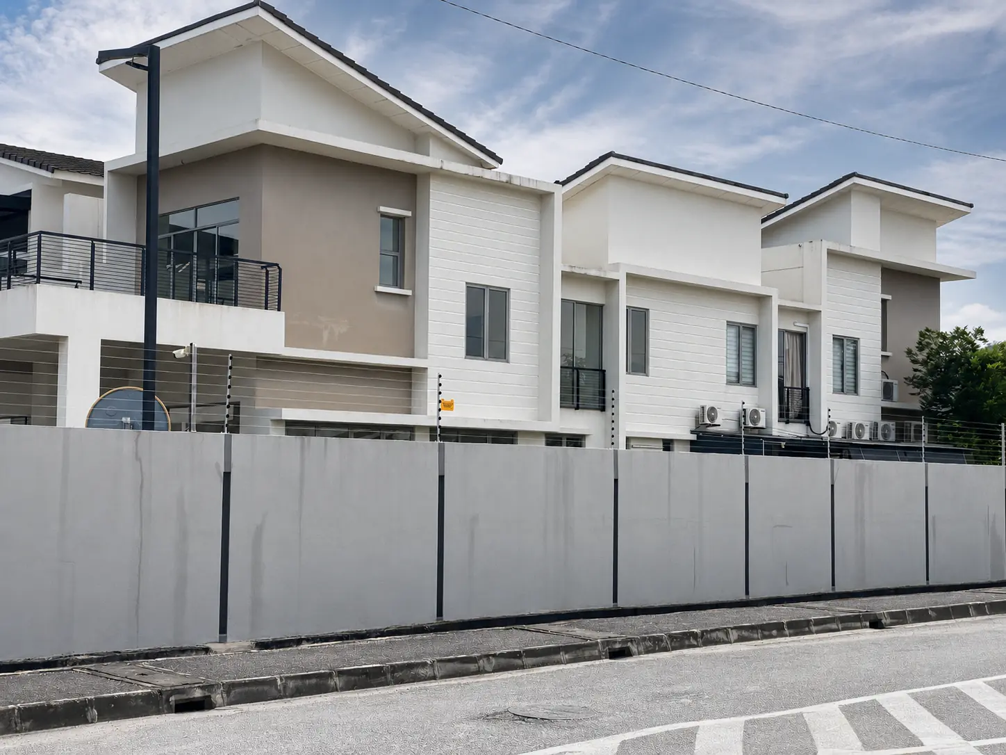 Residential electric fencing installed around modern terrace homes